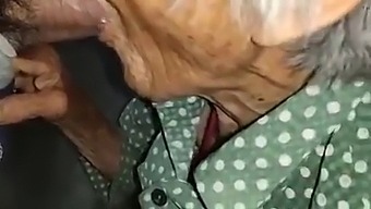 Elderly Chinese Woman Indulges In Explicit Activities